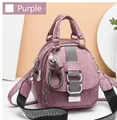 Detail of purple soft leather backpack with litchi texture and metal charms decoration - Purple