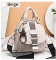 Detail of cream faux leather handbag featuring star charm and striped shoulder strap - White