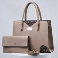 Detailed view of taupe tote bag set with black lace patch and metallic gold hardware - Khaki