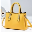 Fashionable lemon yellow trapezoid handbag with silver metal decor and crossbody strap - Yellow