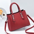 Red matte leather handbag for women featuring silver chain details and shoulder strap - Burgundy