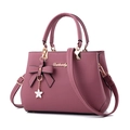 Dark pink pebbled leather handbag for women featuring gold hardware and bow detail - Oak Pink