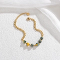 Goldenes Edelstahl-Gliederarmband mit bunten Perlen im eleganten Makronen-Stil - Macaron Blau Gelb