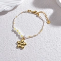 Stainless steel beaded bracelet featuring yellow flowers and a gold floral charm - Gold Solid Flower Style