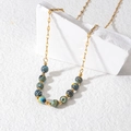 Bohemian gouden ketting met blauw en geel gestreepte kralen op witte steen - Blauw & Geel Macaron Kralen Ketting