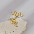 Minimalist gold snake stud earrings with realistic scale texture on white mineral stone - Gold Snake