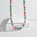 Rainbow beaded necklace with 14K gold plated spacers on geometric white stand - Colorful Agate
