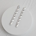 Elegantes pendientes ovalados de plata en acero inoxidable pulido con diseño minimalista - Color Acero