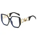 Montatura occhiali oversize nera poligonale con stanghette geometriche dorate - Montatura Nera