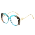 Occhiali ovali blu tartarugati con bordi ondulati e stanghette dorate con piccoli cuori - Esterno Leopardato Interno Blu / Lenti trasparenti