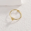 Minimalist snake ring in gold finish featuring bypass design and polished metal spheres - Adjustable Open / Gold