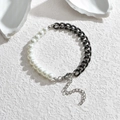 Minimalist pearl and black chain link bracelet with adjustable silver clasp on stone surface - Black
