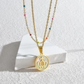 Collier double rang doré avec perles multicolores et pendentif couronne en nacre - Doré