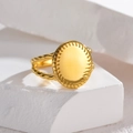 Minimalist gold oval signet ring with radial textured edges and twisted rope band - Gold