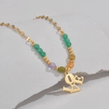 Gold chain necklace with colorful beads and a hanging LOVE letter pendant detail - LOVE Style