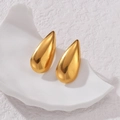 Elegant gold waterdrop stud earrings with high-polished finish on white stone stand - Gold Waterdrop Earrings