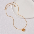 Gold stainless steel necklace featuring a unique beaded heart pendant on a fine curb chain - Gold Heart