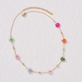 Chic stainless steel gold chain necklace featuring seven colorful beaded flowers - Flower Necklace
