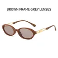 Gafas de sol ovaladas retro con montura marrón, lentes grises y detalles metálicos - Marco Té Lentes Grises