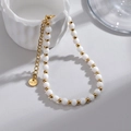 Elegant beaded stainless steel bracelet with alternating white and gold beads - White