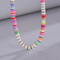 Colorful bohemian style clay bead necklace with gold spacers and white accents - Colorful