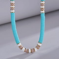 Bohemian colorful heishi clay bead necklace in bright blue and white with gold accents - Lake Blue