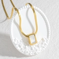 Gold snake chain necklace with square white shell pendant on a white relief platform - Rectangular Mother of Pearl Style (M-N2078)