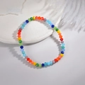 Rainbow beaded bracelet with multifaceted colorful crystals on a white ceramic base - Multicolor Beaded Bracelet (Elastic Cord Style)