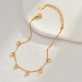 Detail of gold stainless steel heart bracelet with clear cubic zirconia on stone slabs - Heart Charms Style (B1020-aixin)