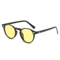 Vintage round sunglasses with shiny black frame and bright yellow lenses at a 45-degree angle - Black Frame Yellow Lens