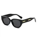 Cat eye sunglasses featuring a glossy black frame and iconic gold quilted metal details - Glossy Black Frame Grey Lens