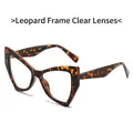 Retro cat-eye sunglasses with tortoise frame and clear lenses in a diagonal view - Regular / Regular (Includes 13% VAT) Leopard Frame with Clear Lenses