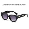 Chic cat eye sunglasses in glossy black with gradient grey lenses and gold accents - Glossy Black Frame Gradient Grey Lens