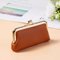 Detailed view of brown litchi pattern leather coin purse with vintage gold metal clasp - Brown