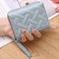Quilted light blue mini coin purse with heart embroidery and hand strap for women - Light Blue
