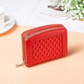 Detail of red synthetic leather wallet featuring 3D diamond quilted pattern and gold zipper - Red