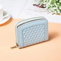 Detail of light blue quilted leather wallet featuring gold zipper and multiple card slots - Light Blue
