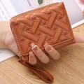 Mini brown PU leather coin purse featuring quilted heart embroidery and wrist strap - Brown