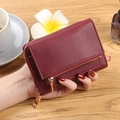 Women's burgundy pebble leather wallet with gold zipper and multi-slot interior - Rumba Red