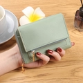 Pale green pebble leather compact wallet with gold zipper and multi-fold card slots - Smoke Green