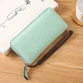 Mint green ostrich leather texture long zip wallet with a dark brown wrist strap - Green