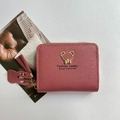 Short rose red wallet with zip closure, featuring gold bear emblem and leather tassel - Deep Pink