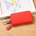 Red lychee grain PU leather key case with silver spring clasp and secure zipper closure - Red