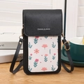 Mini bolso para móvil en cuero lichi negro con estampado floral y detalles dorados - Negro