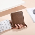 Classic dark brown leather bifold wallet with secure zipper closure and contrast stitching - Brown