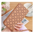 Women's long clutch wallet in tan faux leather with brown chain pattern and wristlet - Brown
