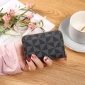 Dark grey geometric pattern card holder with gold zipper in a portable leather wallet - Black