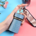 Light blue quilted mini bucket bag with rhinestones, golden hardware, and silk ribbon - Blue