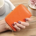 Bright orange PU leather card holder with textured finish and gold zipper closure - Orange