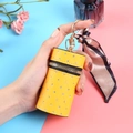 Yellow quilted mini lipstick bag with sparkling rhinestones and a silk bow keychain - Yellow